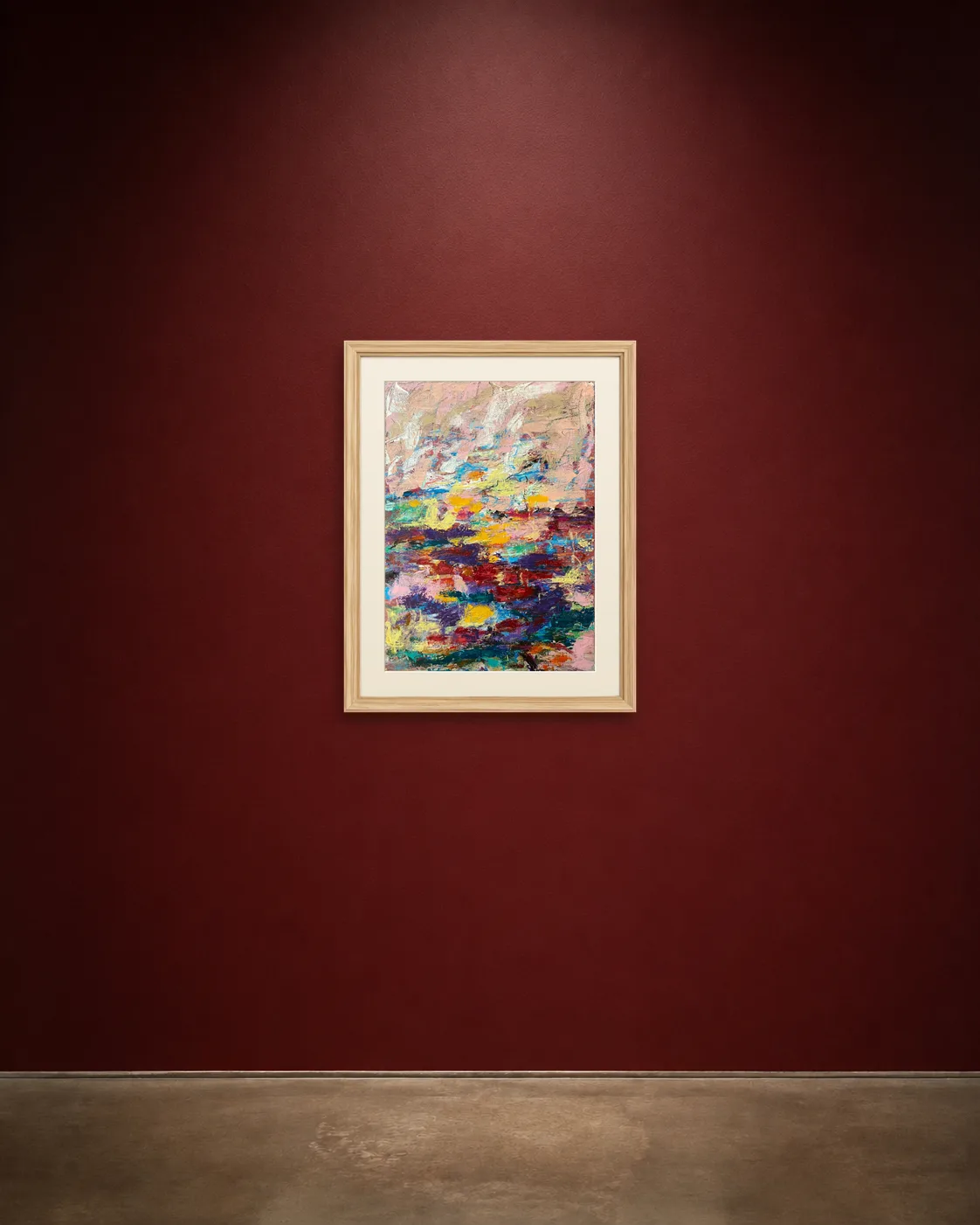 Field Notes shown framed on a burgundy wall