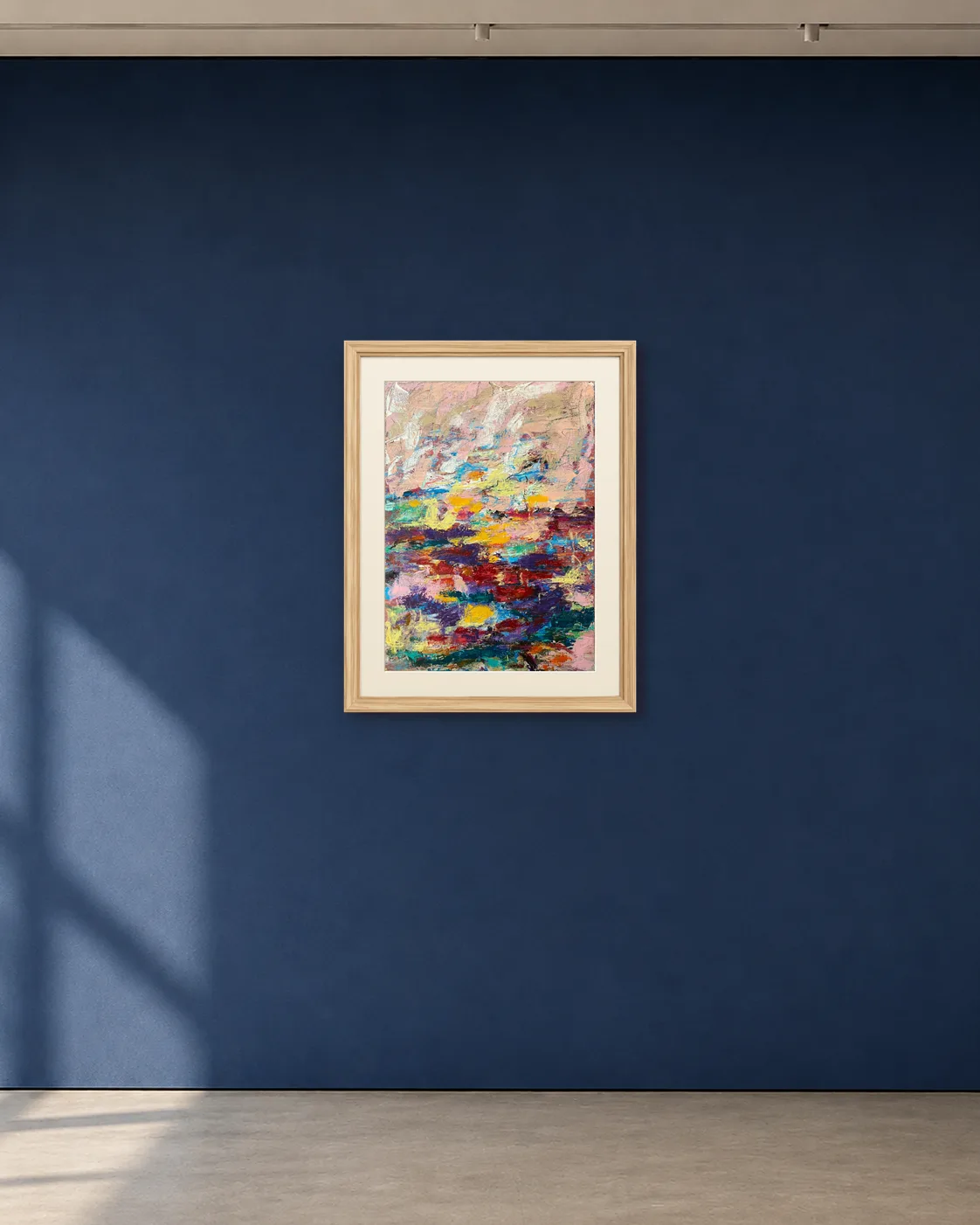 Field Notes shown framed on a deep blue gallery wall