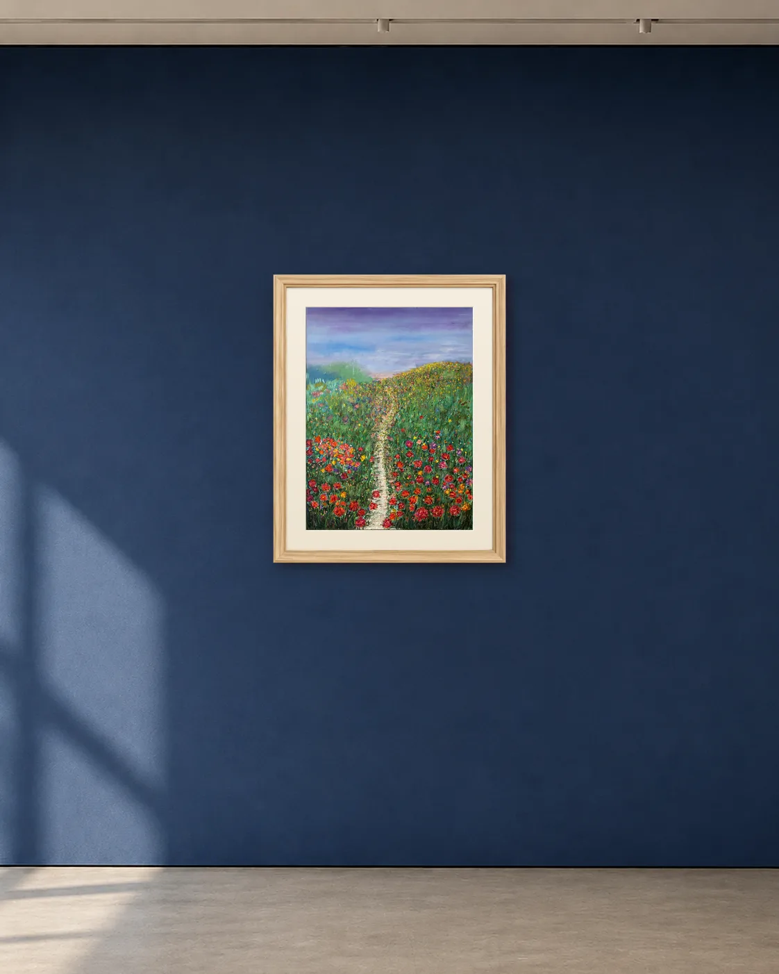 The Field Opens shown framed on a deep blue gallery wall